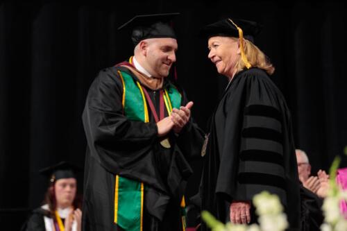 051225 AMC Commencement MW-0772